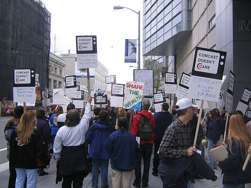 “Comcast protest” by Flikr user Steve Rhodes used under Creative Commons Attribution 2.0 license